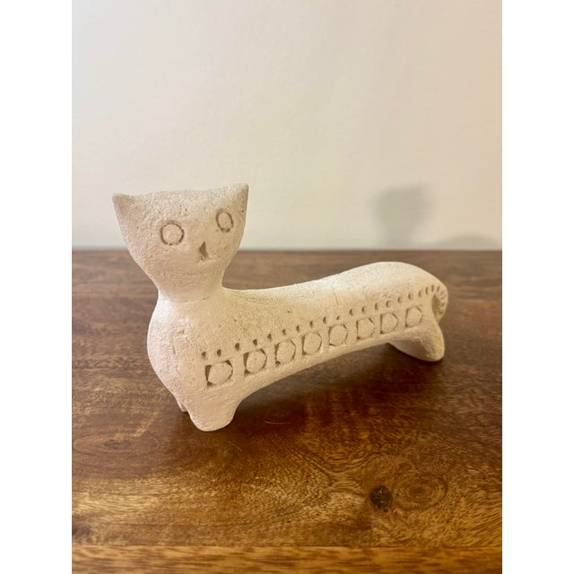 A charming mid-century Italian ceramic cat sculpture by Bitossi for Flavia, Italy. Finished in a matte white glaze with...