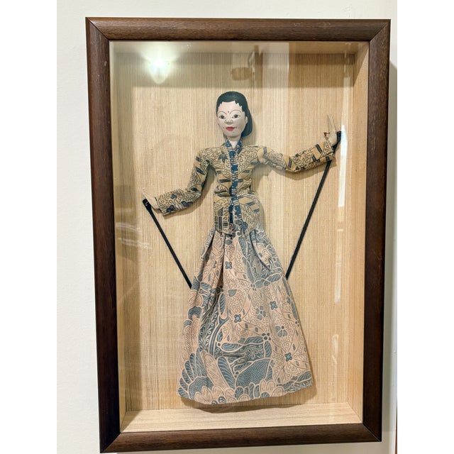 A striking pair of vintage Indonesian Wayang Golek rod puppets, beautifully presented in coordinating wood shadow box...