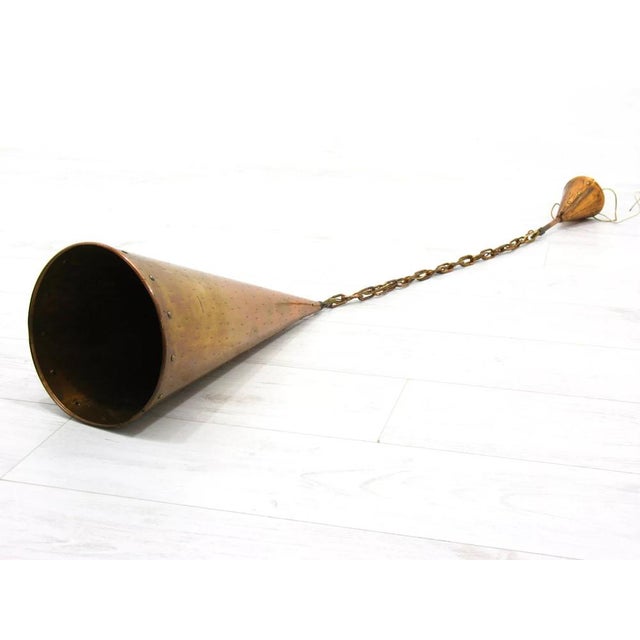 Danish hanging lamp in the form of a copper cone, 1970s. Up to 250V (Europe/UK Standard).The wiring of this item may be...