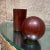 For your consideration, a Modern Nesting Salt & Pepper Shaker Rosewood Ball + Cylinder, Circa the 1960s. Original caps in...