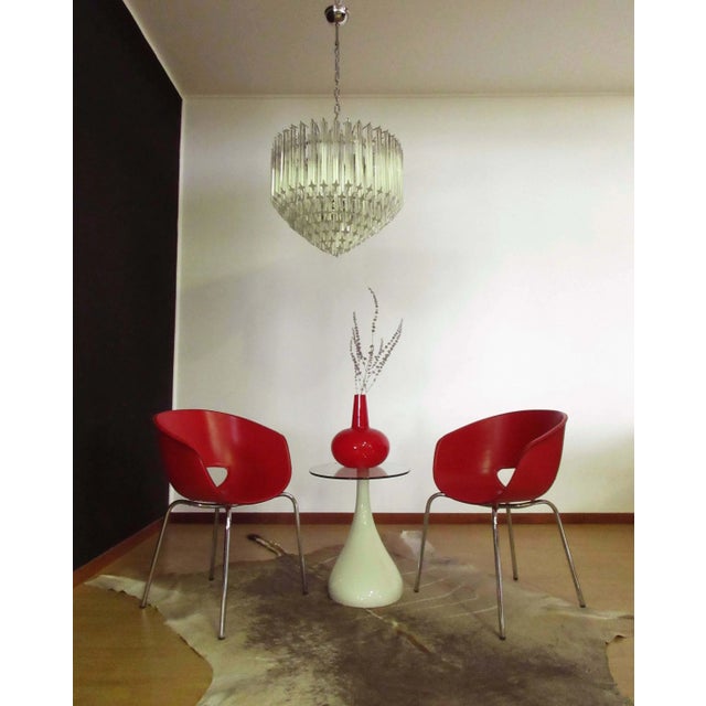 A magnificent Murano glass chandelier, 163 quadriedri on nickel metal frame. This large Mid-Century Italian chandelier is...