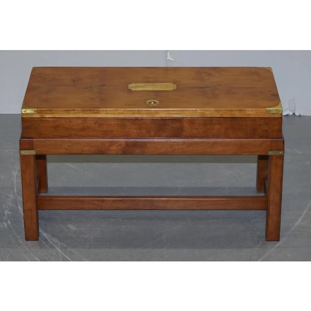 A very rare highly collectable Burr Yew Wood Military Campaign gun case with original stand formed as a coffee table This...