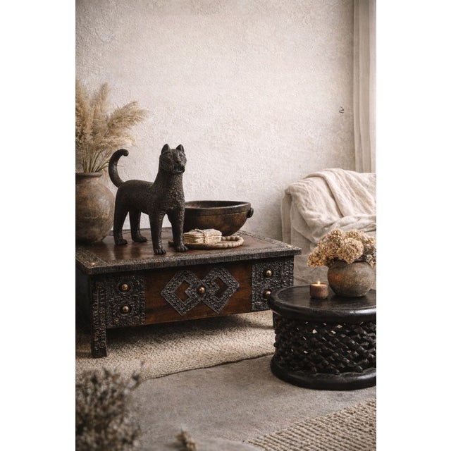Bamileke coffee table, hand-carved from a single piece of wood, embodies the artisanal excellence of the Bamileke people...