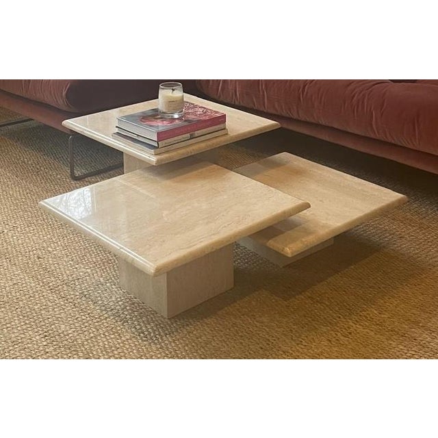 Vintage set of three stackable square travertine coffee tables, originally purchased from Friends of Form. The versatile...