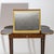 Transformation table, on high square pointed legs with brass sabots and curved table top including intermediate shelf with...