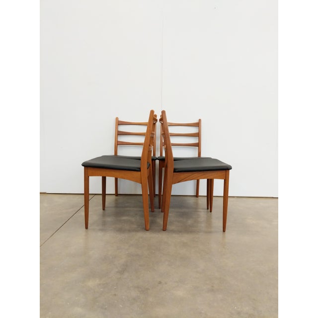 Set of 4 authentic vintage mid century modern dining chairs. By Greaves and Thomas. Maker's label on bottom of 1 chair....