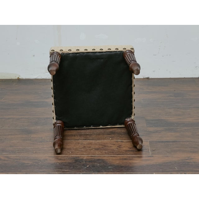 Rooted in 19th-century English craftsmanship, this mahogany stool balances refinement and function with its sculpted...
