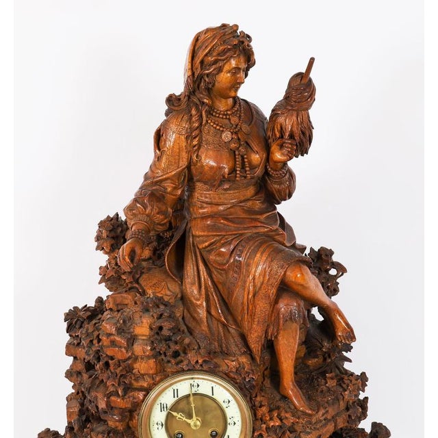 A large swiss extremely finely carved museum quality linden wood table top clock by c.v. Bergen, interlaken, swiss circa...