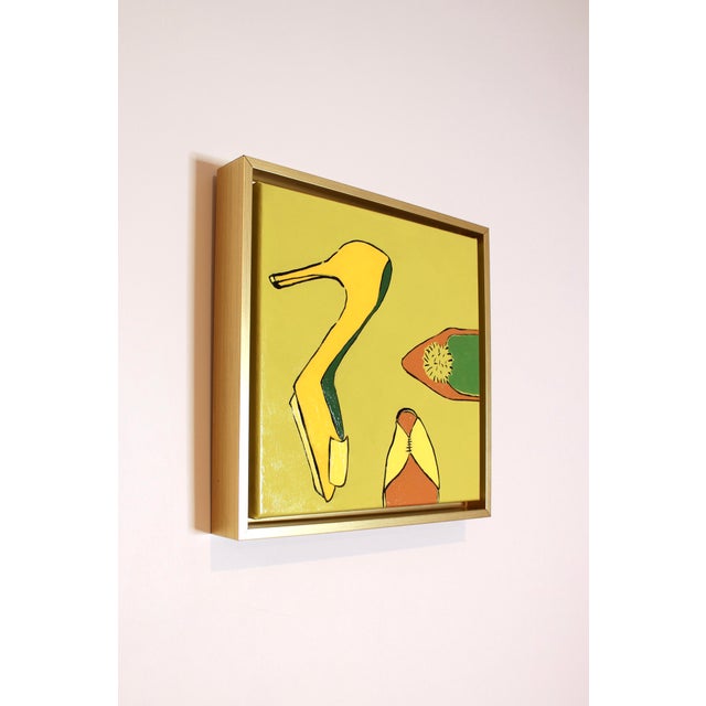 Nearly green, this neon yellow catches your eye for it's unique pallet and funky subject matter. Three shoes framed in...