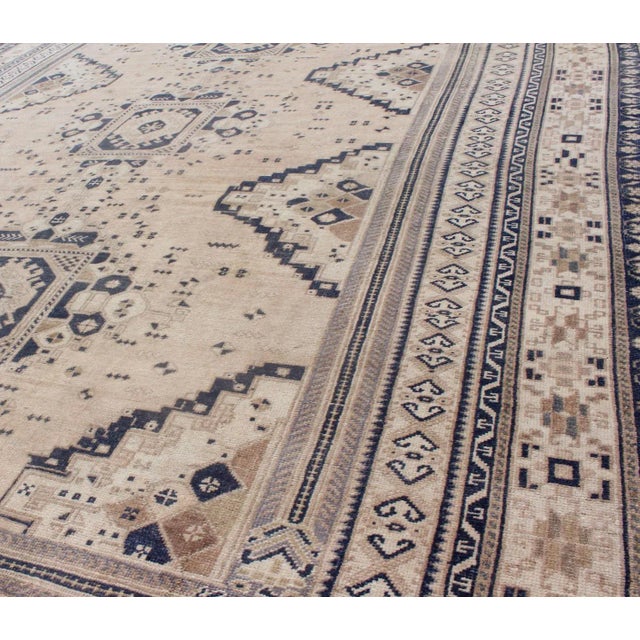 Textile Vintage Turkish Oushak Rug Featuring Soft Beige Field With Navy Tribal Design For Sale - Image 7 of 9