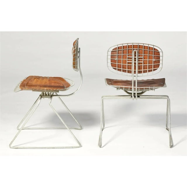 A matched set of four Michel Cadestin and Georges Laurent leather and metal Beaubourg chairs, from the Centre Georges...