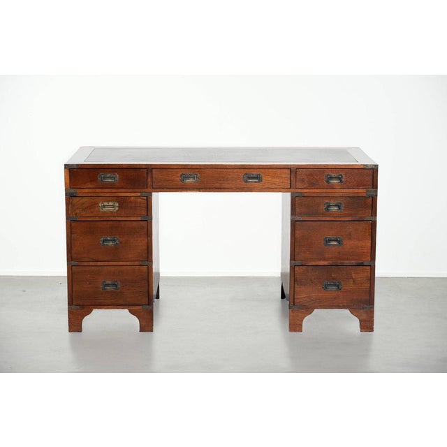 Offered is this antique writing desk / partner desk with 4 drawers and a green leather top with a beautiful appearance....