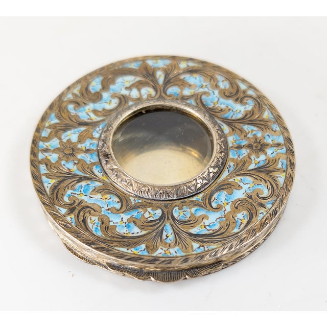 We are selling this pretty Italian 800 silver make up compact. This piece has engraved floral decoration along with baby...