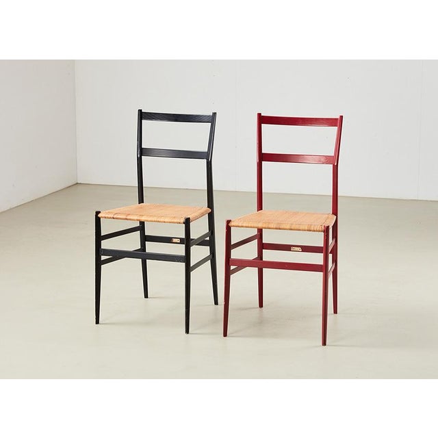 Pair of Superleggera (= very light) chairs, model 699. designed by Gio Ponti from 1951-1957 for Cassina Italy. A modern...