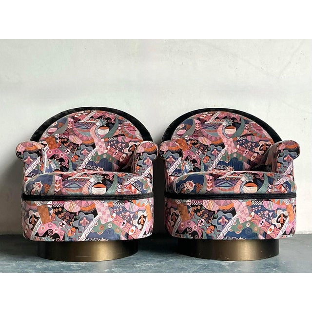 Bring a bold touch of postmodern artistry into your space with this striking pair of Martin Brattrud swivel chairs....