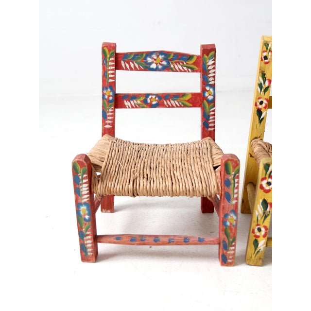 Brighten up any space with this pair of vintage Mexican children's chairs. Hand-painted in vibrant red and yellow with...