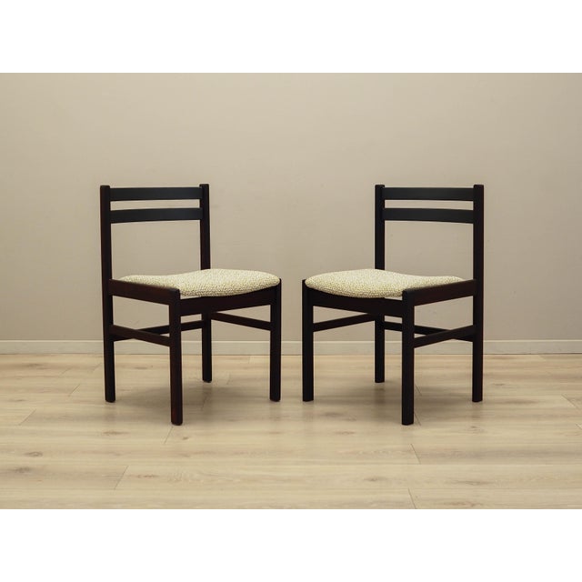 The set of two chairs made in the 1970s, Danish production. The frame is made of rosewood. The wood has been refreshed....