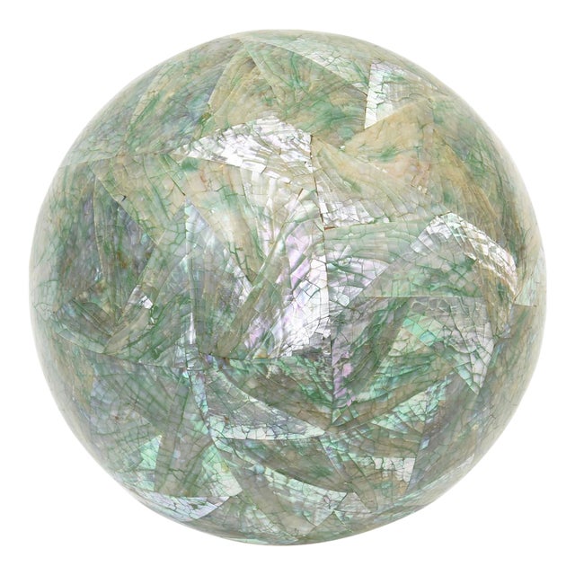 This beautiful sphere sculpture from the 70's is Mother of Pearl over wood on a lucite base. It is from the 70's. it has a...