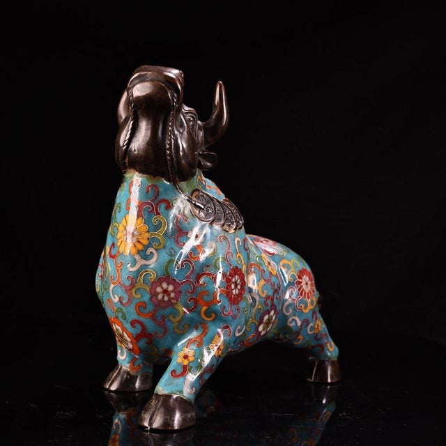 This striking vintage cloisonne enamel figurine depicts a powerful ox or bull, a traditional symbol of strength,...
