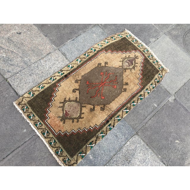 This is a vintage Turkish Oushak rug from the 1960s. The piece was hand-knotted.