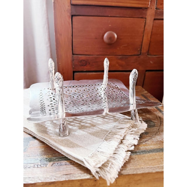 An antique circa 1905 silver plated asparagus serving rack from The Hotel Baltimore in Kansas City. In fantastic...