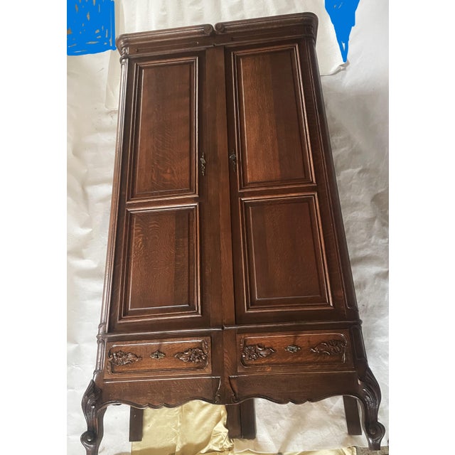 A beautiful, original oak wardrobe in the Louis XV/Rococo style, crafted in Central Europe at the turn of the 20th...