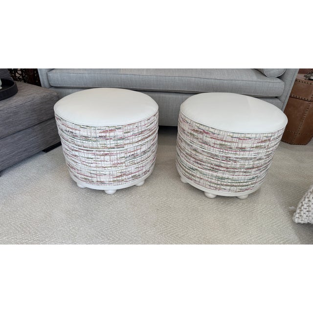 Custom set of 2 Wesley Hall round ottomans, currently on their website. Beautiful raspberry, teal, and green on cream...