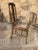 Lovely very old sturdy wooden chair with real character. Cane seat is in excellent condition. Artisan made with dowels....