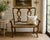 Graceful and inviting, this French Provincial-style settee combines classic European lines with the warmth of natural...