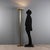 Floor lamp made of brass, features a halogen light. This piece is attributed to the mentioned designer/maker. It has no...