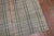 A rare matching set of rag rug runners containing a plaid motif on a straw colored ground from the mid-20th century...