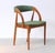 Organic shaped side chairs in teak designed by the Danish designer Johannes Andersen. The comfortable chairs feature a...