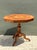 This vintage octagonal table showcases exquisite marquetry work in richly patinated wood, with an intricate starburst...