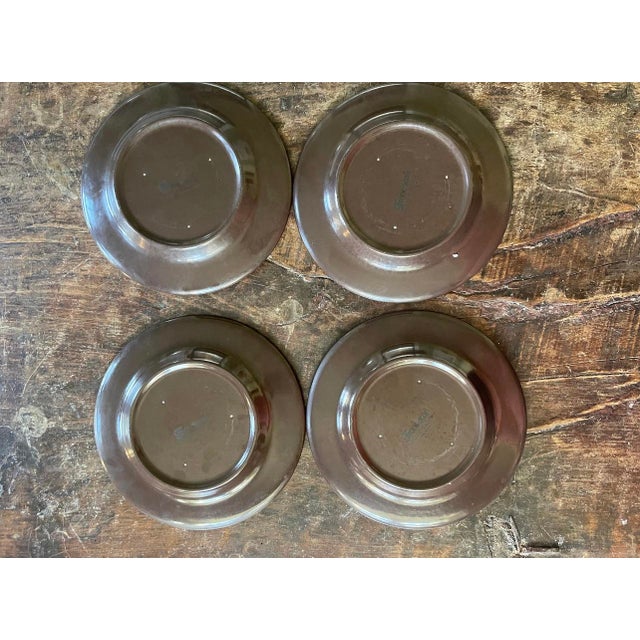 Charming set of four plates by Franciscan in the Madeira pattern, presented in a deep chocolate brown with a pattern and...