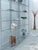 An absolutely stunning, minimalist, and delicate, and very rare interlocking shelf made of chrome-plated steel elements...