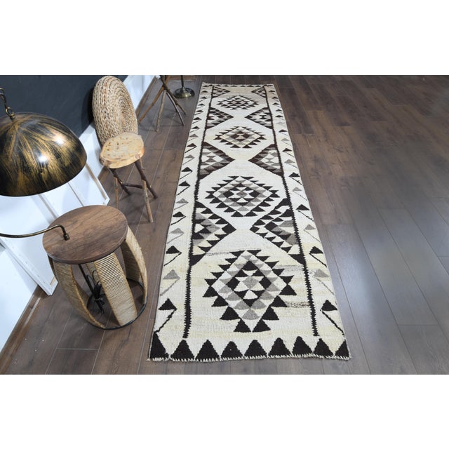 Vintage Turkish Hand-Knotted vintage rug is a semi-antique vintage runner rug. The '70s Eastern region of Turkey's unique...