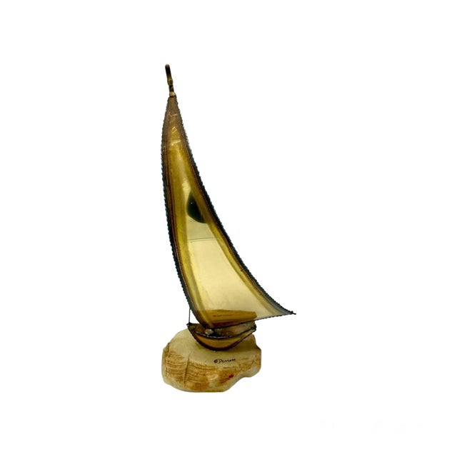 Beautiful tall brass, white onyx and steel sailboat. Created by California artists John & Don Demott. Delicately...