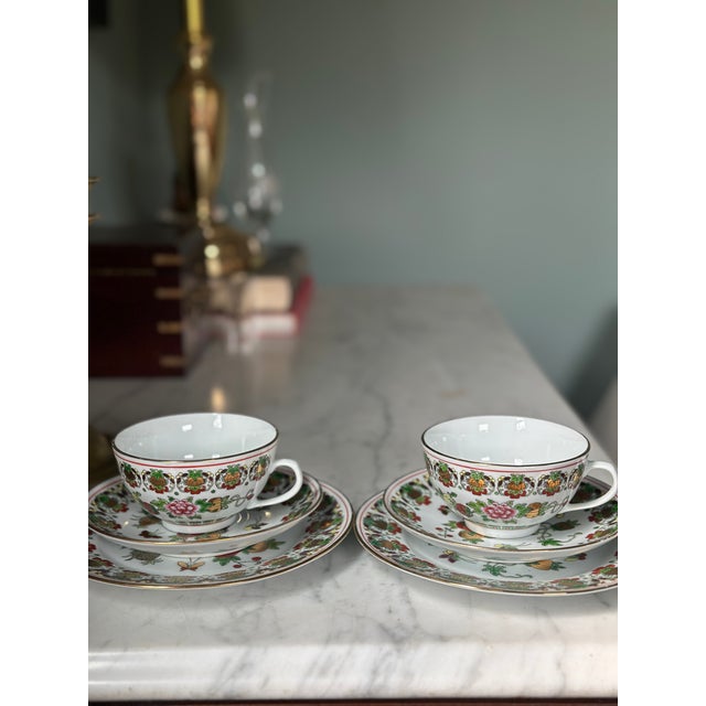 Offered is a stunning, mid-to-late 20th-century Chinese export porcelain tea service for two, meticulously hand-decorated...