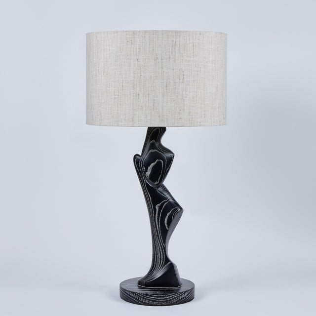 Wonderful pair of highly sculptural lamps of cerused oak. Exhibiting a somewhat primitive, yet modern aesthetic, the lamps...