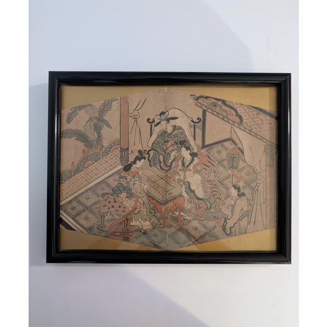 This is an early Edo-period Japanese ukiyo-e woodblock print mounted in a traditional fan leaf shape (ōgata-e). Subject...