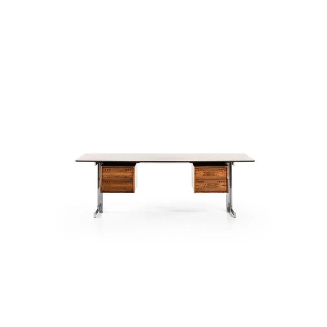 Freestanding desk in rosewood and chromed steel by jan lunde knudsen, 1960's material: rosewood and chromed steel style:...