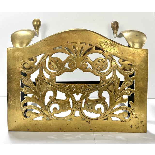 A beautiful 19th century English brass fireplace footman stool featuring pierced scrollwork and elegant cabriole legs....