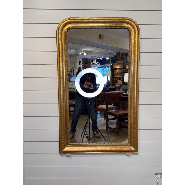 This is a gorgeous 19th Century Louis Philippe mirror! The mirror features a beautiful gold bead design on the inner...