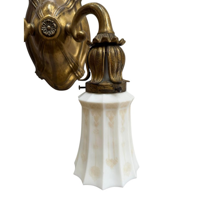 This is such a great neoclassical wall sconce. The beautiful brass sconce is full of great detail and craftsmanship. The...