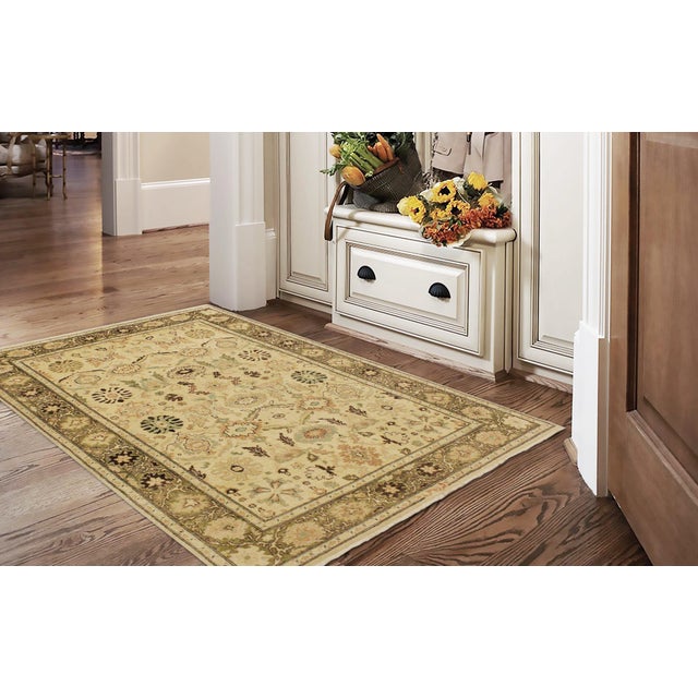 Enhance the ambiance of your home with this magnificent Persian-influenced Turkish hand-knotted rug made by skilled...