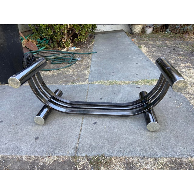 This Vintage Art Deco Tubular Smoked Glass coffee table by Romeo Rega features a stylish and unique design with a harp...