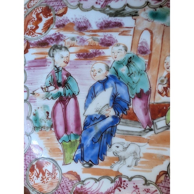 Finely painted rose mandarin porcelain saucer with 4 characters and 1 dog at the base, plus 4 larger and 4 smaller windows...