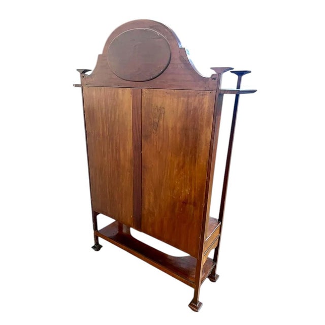 A Scottish Mahogany and Fruitwood inlaid Vitrine Demi-Lune Cabinet made by Paterson, Smith, & Innes of Edinburgh. Maker's...