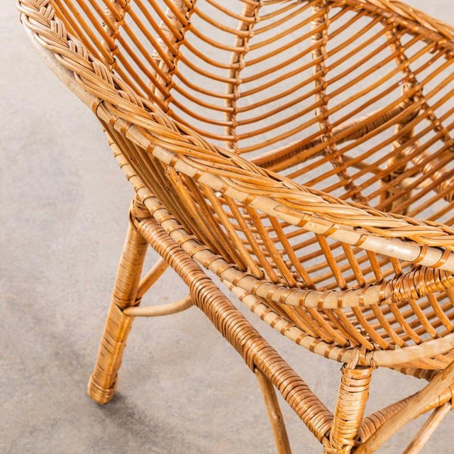 : 1960’s French Rattan Dish Armchair. Good simple French chair from the sixties in very good original condition with...