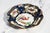 A captivating example of 19th-century English decorative artistry, this hand-painted porcelain plate is a true celebration...